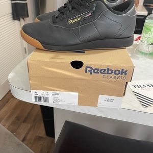 Size 8 Women’s black and gum bottom Reebok’s